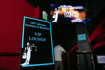 Sign reads "Lieff Cabraser Heimann & Bernstein VIP Lounge" 