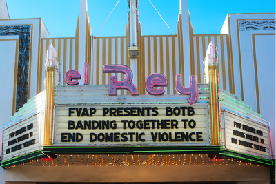 Photo of the El Rey sign reads "El Rey FVAP Presents BOTB Banding Together to End Domestic Violence"