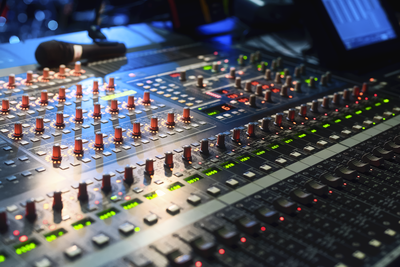 Closeup of the soundboard with green and red lights.